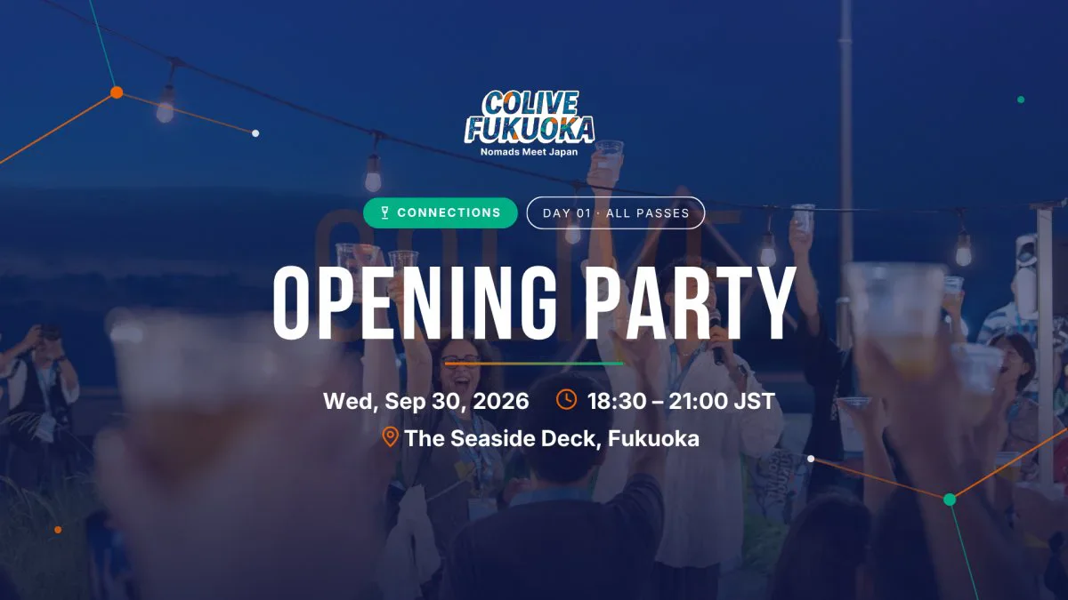 Colive Fukuoka guests raising their glasses at an outdoor waterfront party